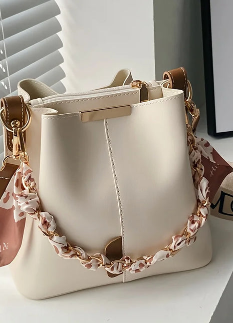 Nuevo bolso de hombro a la moda para mujer, bolso tipo cubo con cadena de cinta de gran capacidad, bolso cruzado para desplazamientos diarios